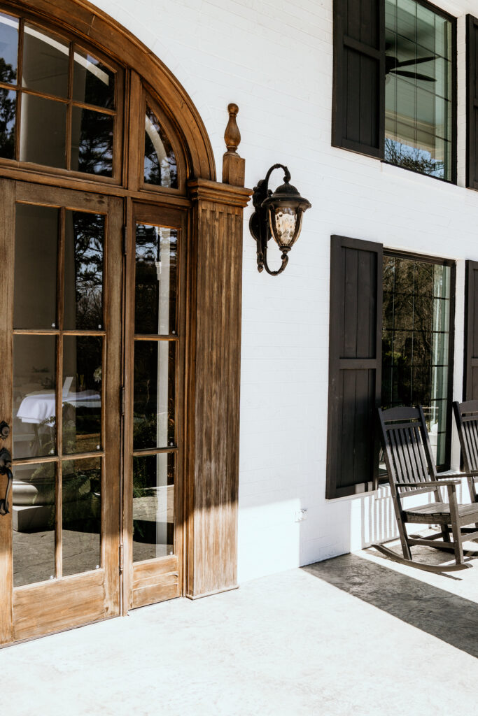 Large vintage brown solid wood door to enter the venue