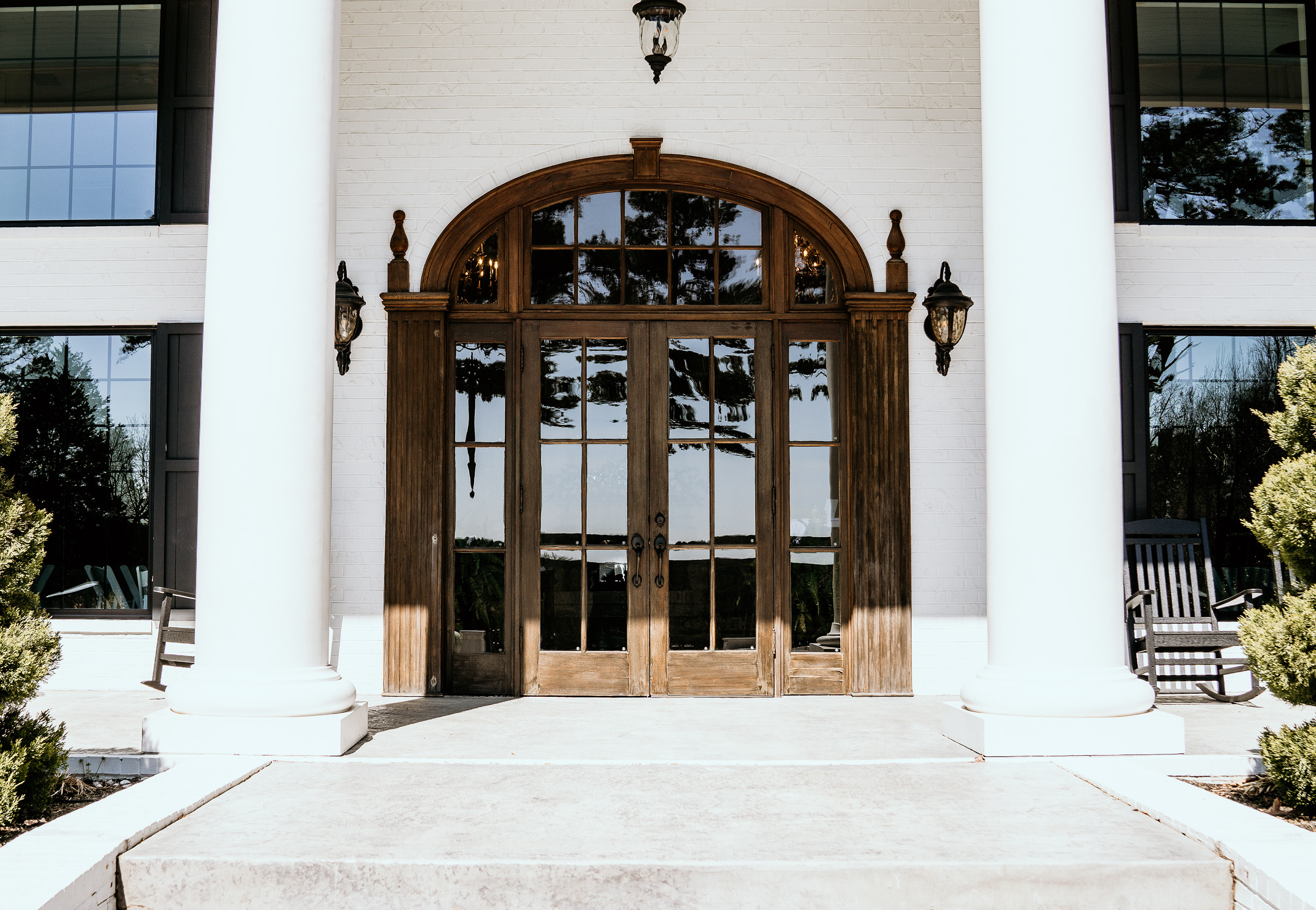 Entrance of Houston's Venue – large vintage brown wooden doors