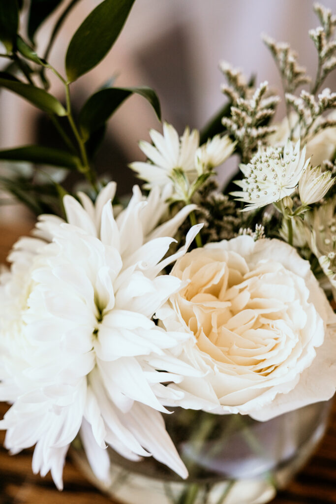 White and ivory blooms surrounded by greenery