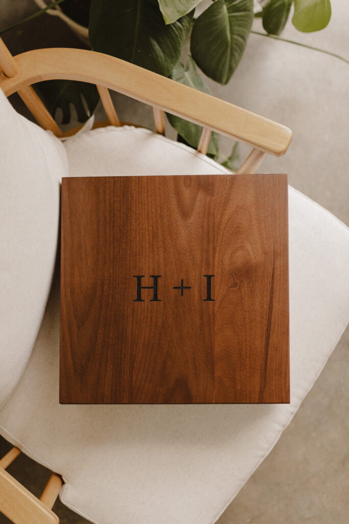 Walnut storage box for photo album engraved "H + I"